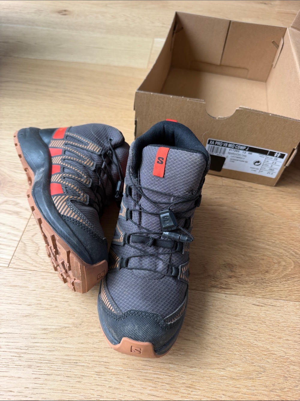 Salomon Kids Trail Running/Approach Shoes in Black with Orange Accents